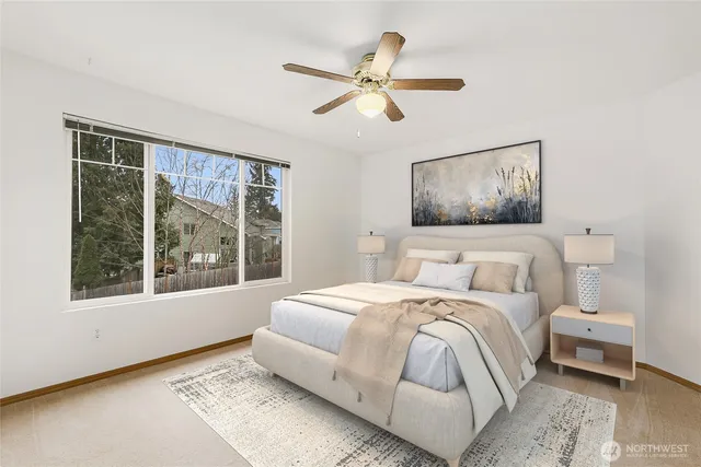 a bedroom with a large bed and a window