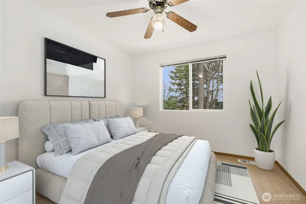 a bedroom with a bed and a window