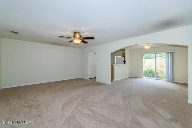 a kitchen that has a sink and a stove in it