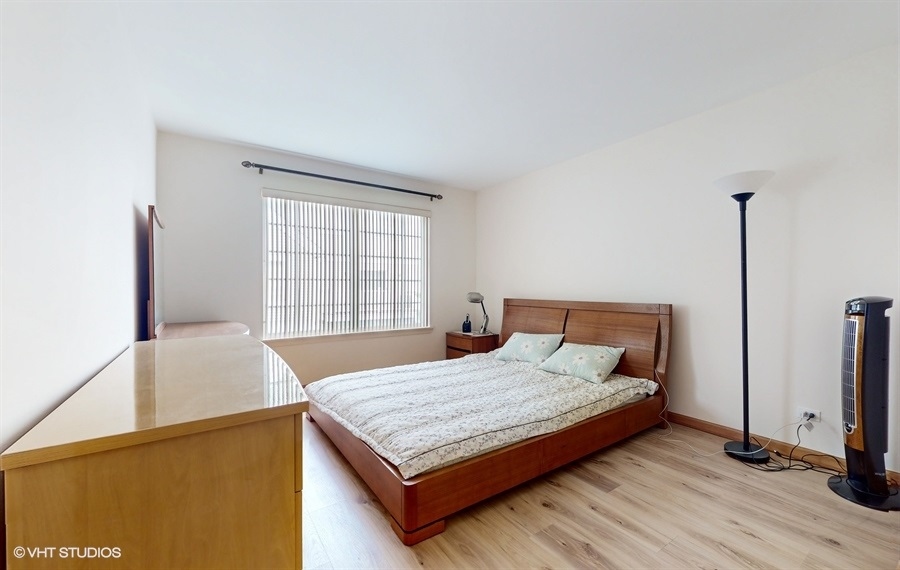 1725 Sienna Court Wheeling, IL 60090 - Photo 14 of 33 a bedroom with a bed and window