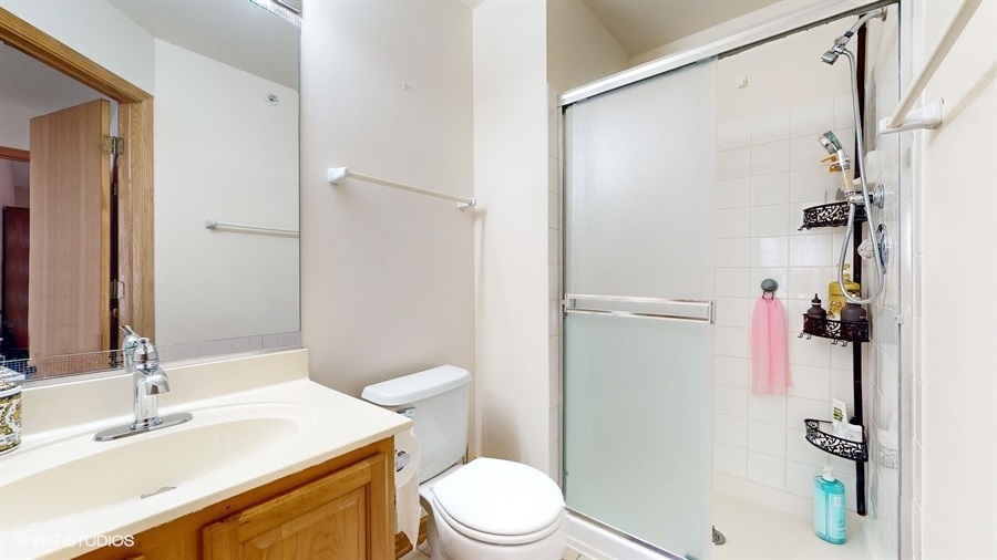 1725 Sienna Court Wheeling, IL 60090 - Photo 16 of 33 a bathroom with a sink toilet and shower