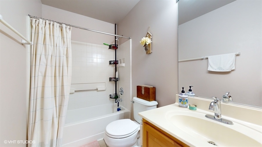 1725 Sienna Court Wheeling, IL 60090 - Photo 19 of 33 a bathroom with a sink toilet and shower