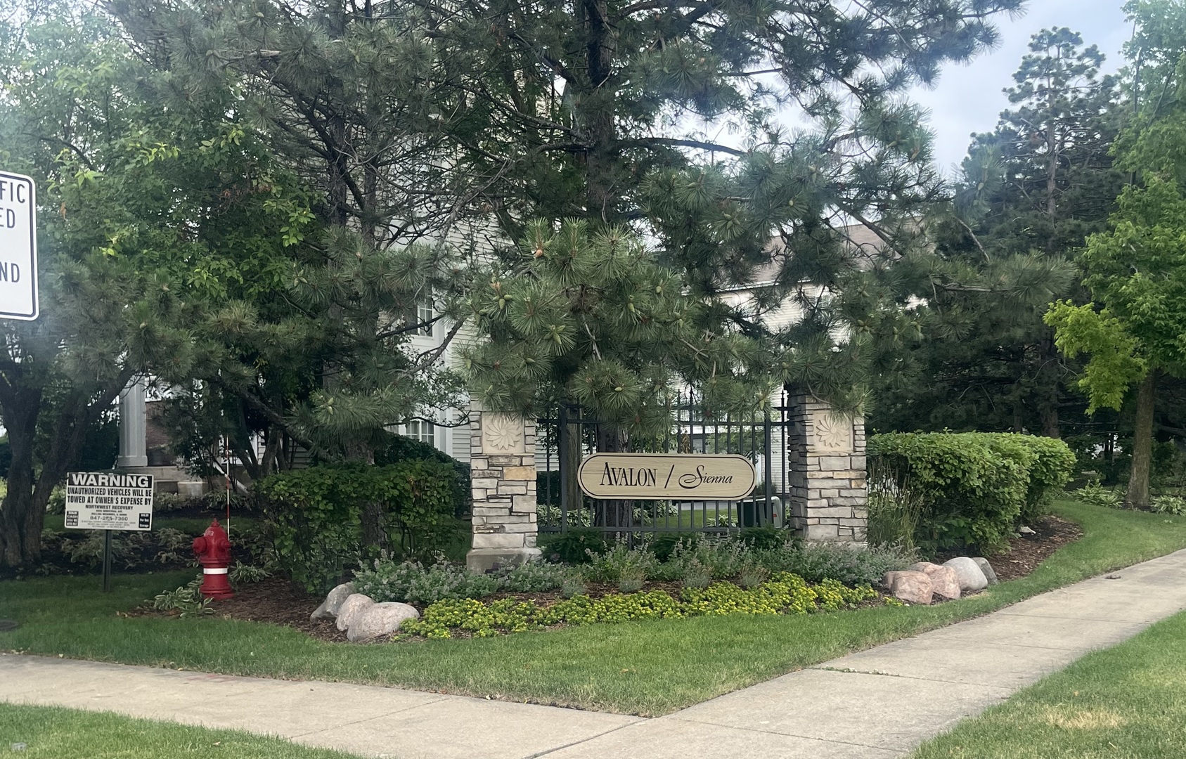 1725 Sienna Court Wheeling, IL 60090 - Photo 28 of 33 a sign that is sitting in the grass