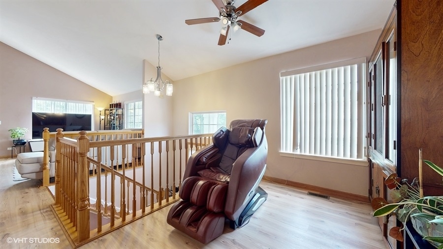 1725 Sienna Court Wheeling, IL 60090 - Photo 8 of 33 a view of a hallway with furniture and windows