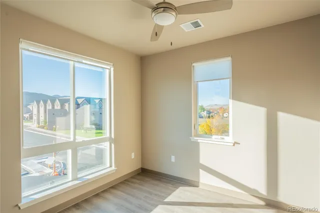 a view of an entryway with wooden floor