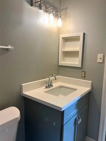 a bathroom with a sink and a toilet