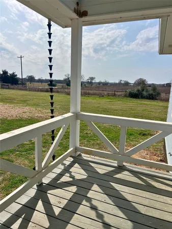 a view of a balcony with ocean view