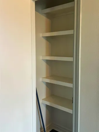 a storage room with a wooden floor