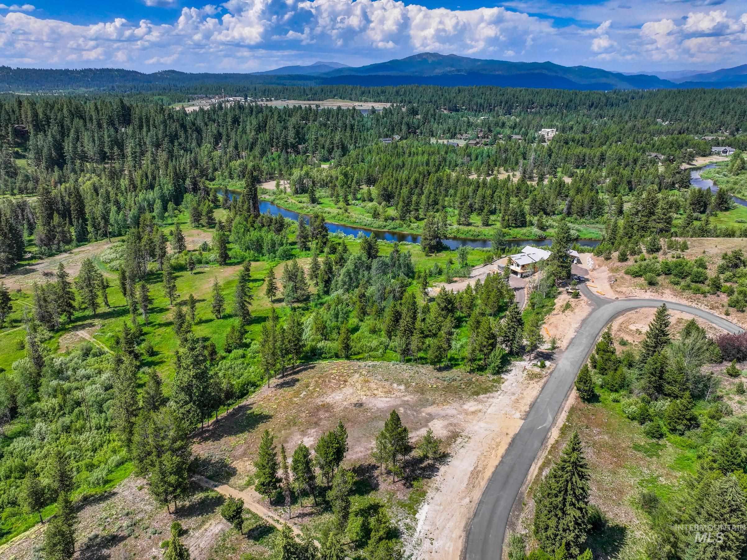 Lot 60 River Ranch McCall, ID 83638 - Photo 13 of 20 Aerial view of property's location featuring a heavily wooded area and a water and mountain view