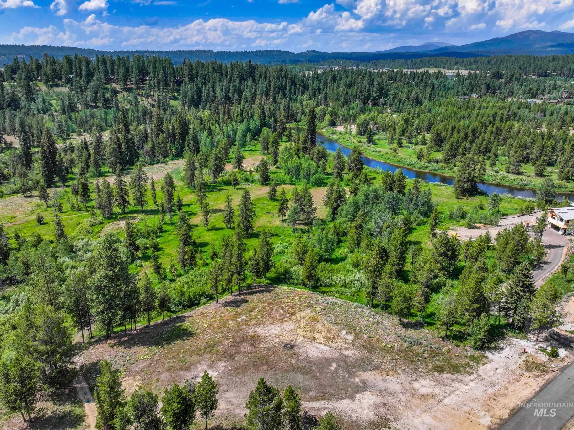 Lot 60 River Ranch McCall, ID 83638 - Photo 9 of 20 Drone / aerial view of a heavily wooded area and a water and mountain view