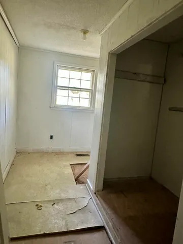 a room with wooden cabinets washer and dryer