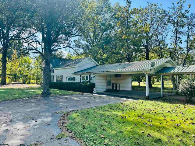 a house view with a garden space