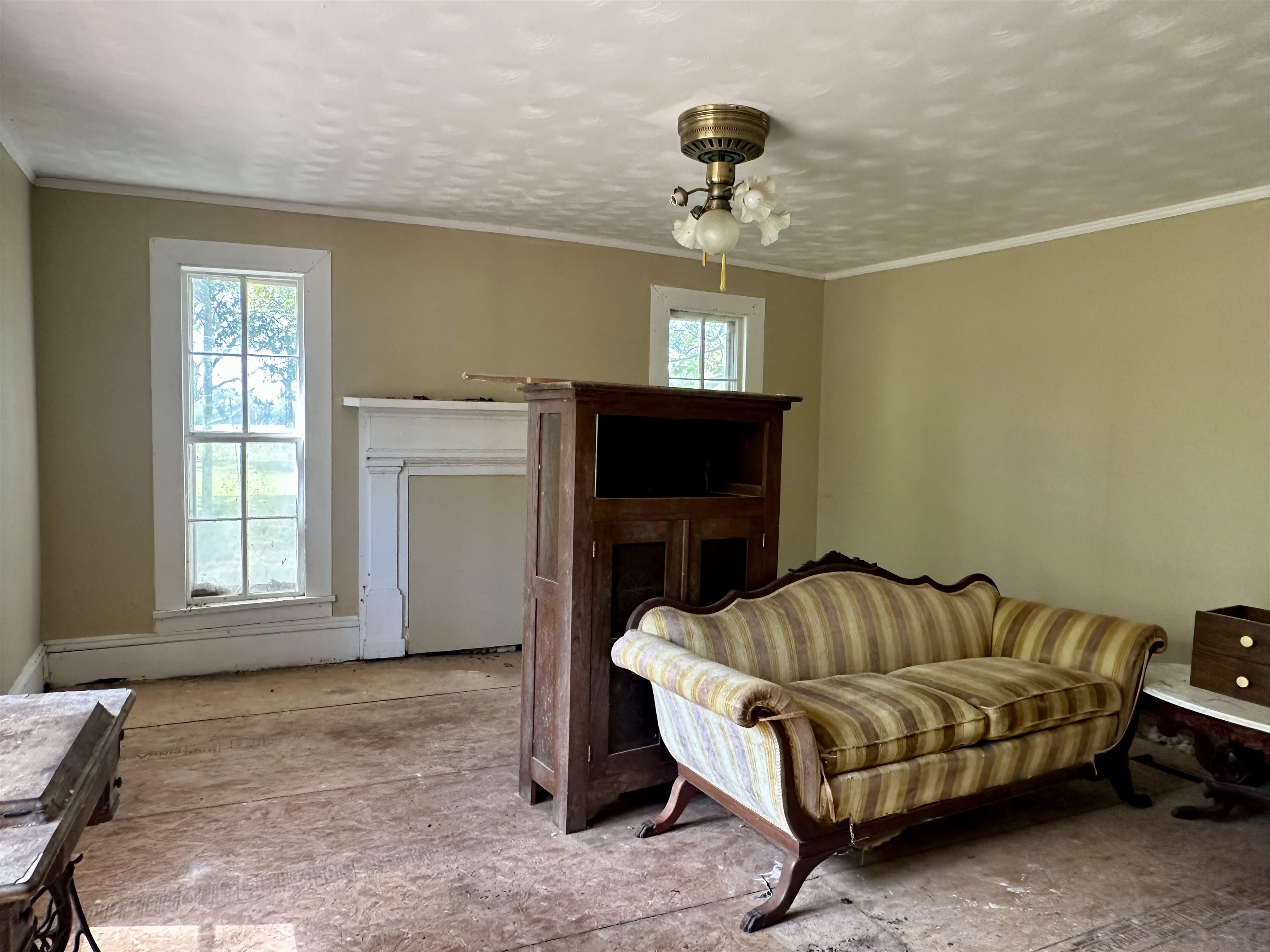 203 Wenasoga Road Ramer, TN 38367 - Photo 8 of 32 Living area with ornamental molding and a textured ceiling