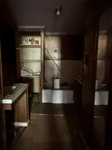 a view of a livingroom with furniture and a window