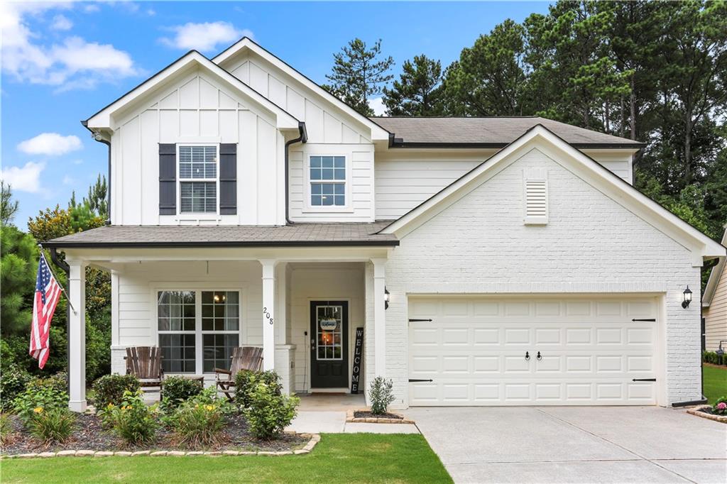 208 Springwall Circle Canton, GA 30115 - Photo 1 of 1 a view of a white house with large windows and a yard