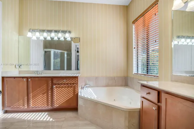 a bathroom with a bathtub and a sink