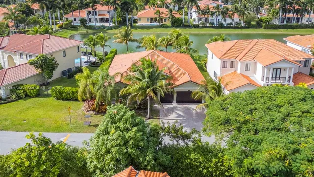 an aerial view of a house with outdoor space lake view and lake view
