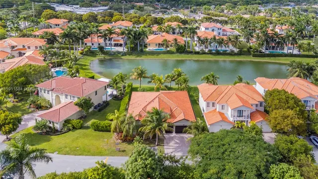 an aerial view of a house with a lake view and a lake view