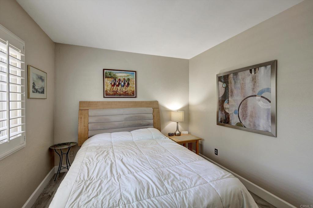 108 Blue Ash Court Encinitas, CA 92024 - Photo 15 of 35 a bedroom with a bed and a painting on the wall
