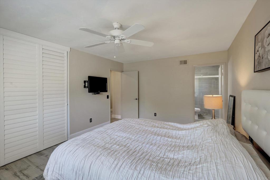108 Blue Ash Court Encinitas, CA 92024 - Photo 19 of 35 a bedroom with a bed and a flat tv screen on dresser