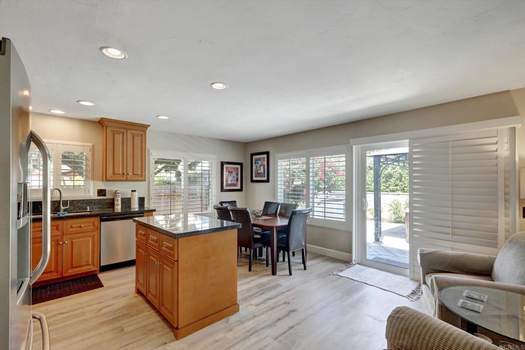 108 Blue Ash Court Encinitas, CA 92024 - Photo 5 of 35 a living room with furniture and kitchen view