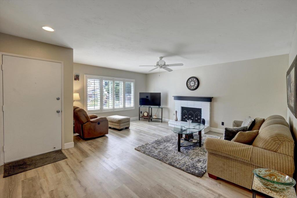 108 Blue Ash Court Encinitas, CA 92024 - Photo 7 of 35 a living room with furniture or couch and a fireplace