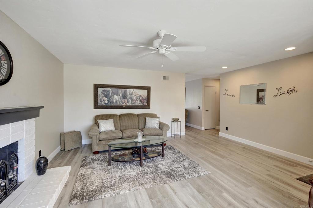 108 Blue Ash Court Encinitas, CA 92024 - Photo 8 of 35 a living room with furniture and a fireplace