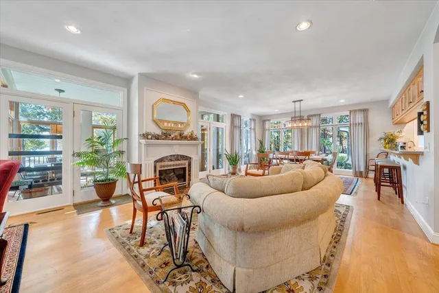 a large kitchen with stainless steel appliances a large counter top a stove and a refrigerator