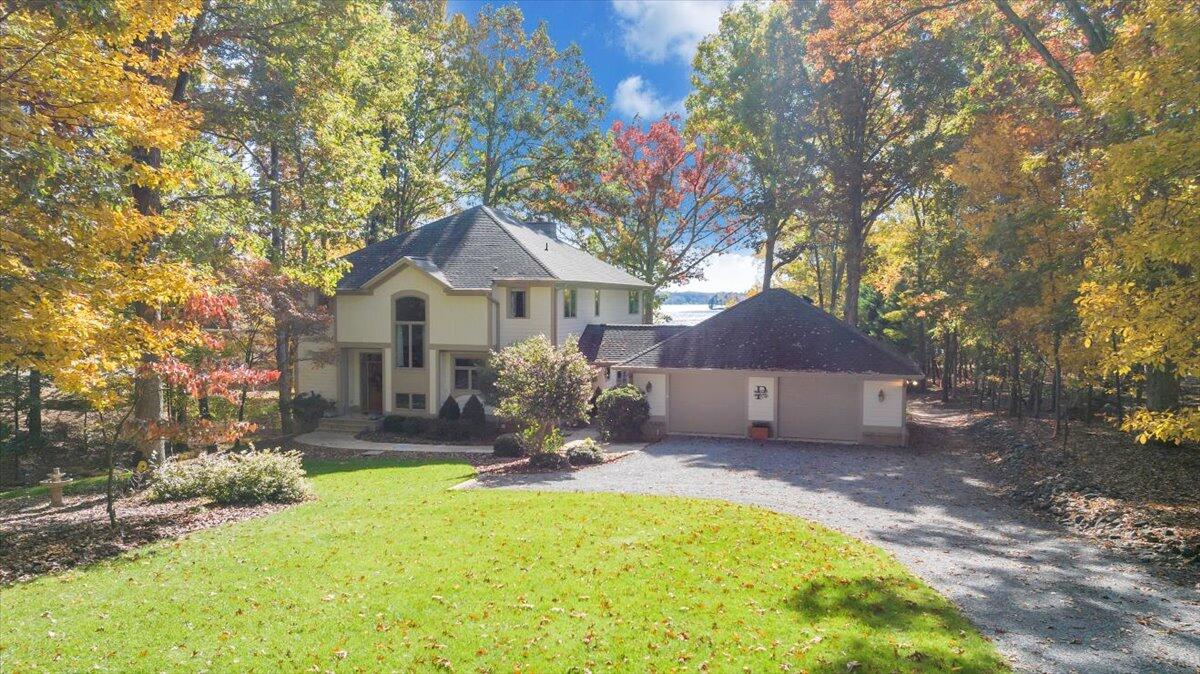 190 Tranquility Road Moneta, VA 24121 - Photo 131 of 170 a front view of a house with a yard and large tree