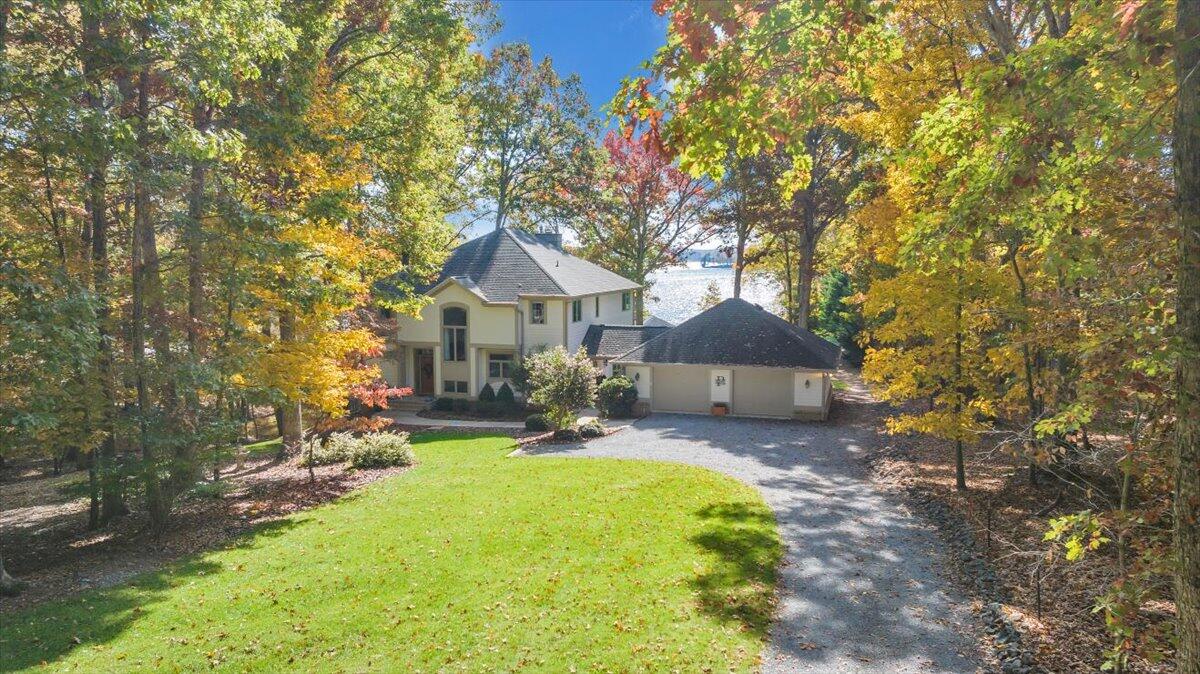 190 Tranquility Road Moneta, VA 24121 - Photo 132 of 170 a front view of a house with a yard and large tree