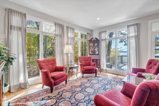 a spacious bedroom with a bed and a lamp