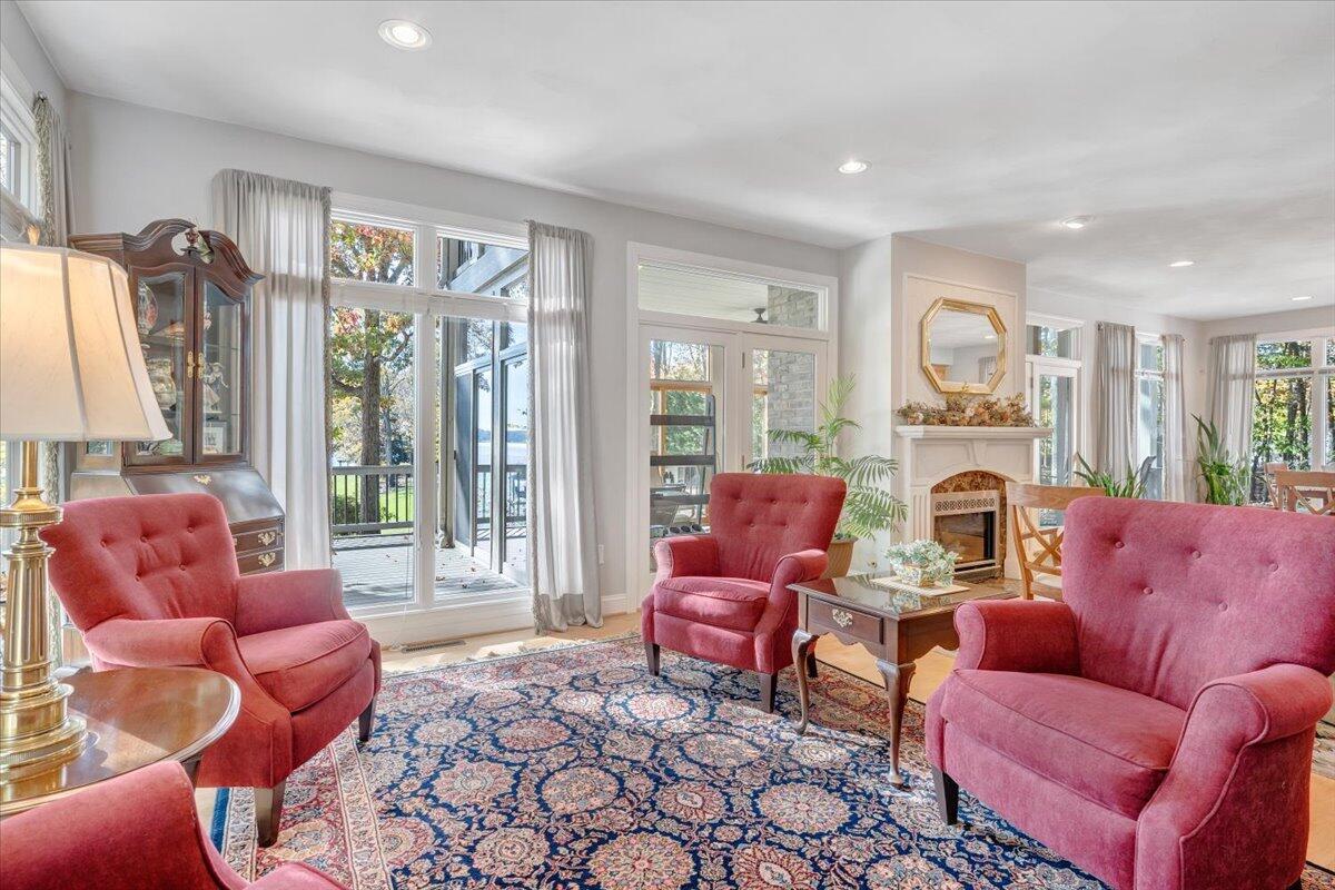 190 Tranquility Road Moneta, VA 24121 - Photo 22 of 170 a living room with furniture fireplace and a large window