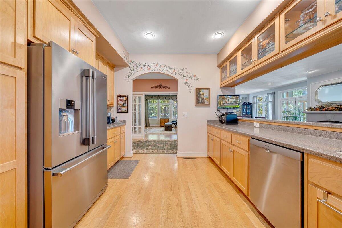 190 Tranquility Road Moneta, VA 24121 - Photo 39 of 170 a large kitchen with stainless steel appliances a large counter top a stove and a refrigerator