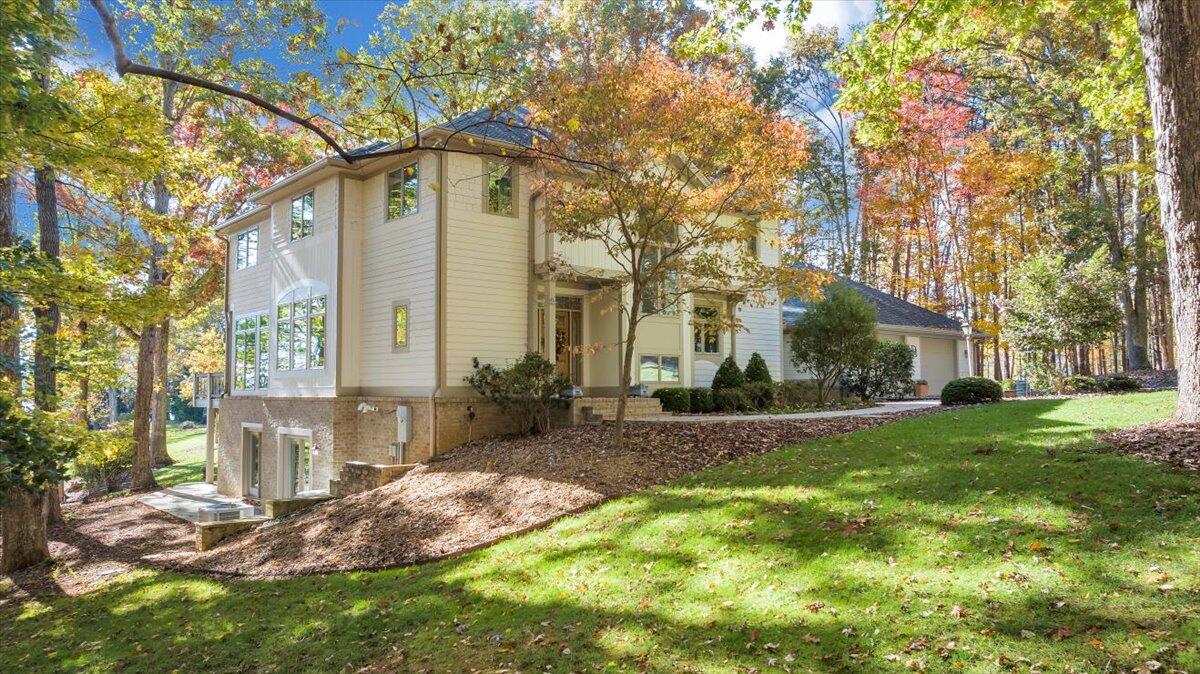 190 Tranquility Road Moneta, VA 24121 - Photo 4 of 170 a front view of a house with garden and trees