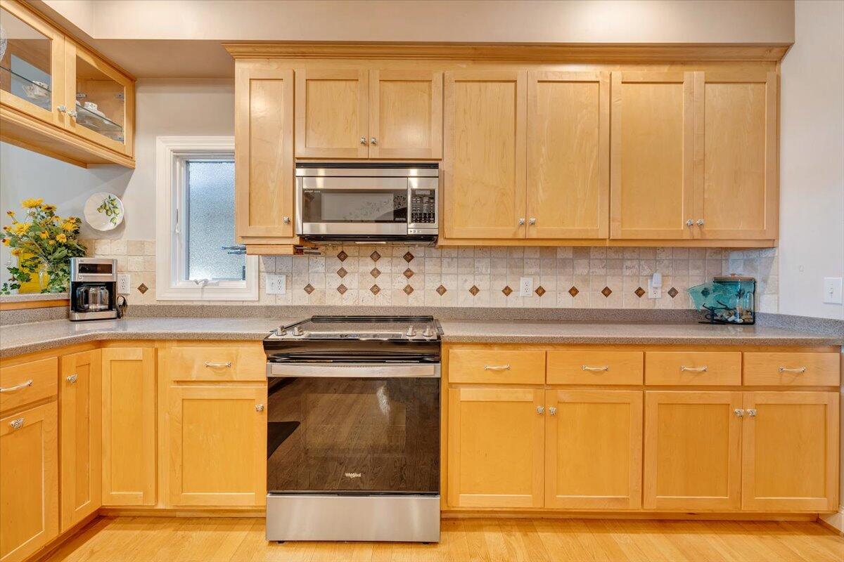 190 Tranquility Road Moneta, VA 24121 - Photo 41 of 170 a kitchen with stainless steel appliances granite countertop a stove a sink and a microwave