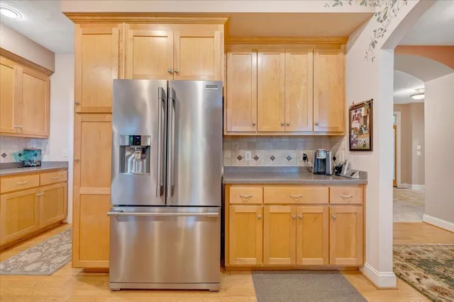 a view of a field with large trees