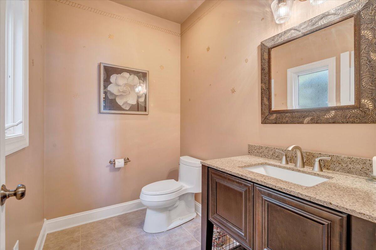 190 Tranquility Road Moneta, VA 24121 - Photo 52 of 170 a bathroom with a granite countertop sink mirror and toilet
