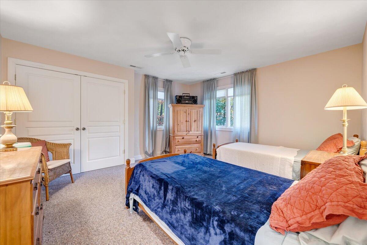 190 Tranquility Road Moneta, VA 24121 - Photo 60 of 170 a spacious bedroom with a bed and a lamp