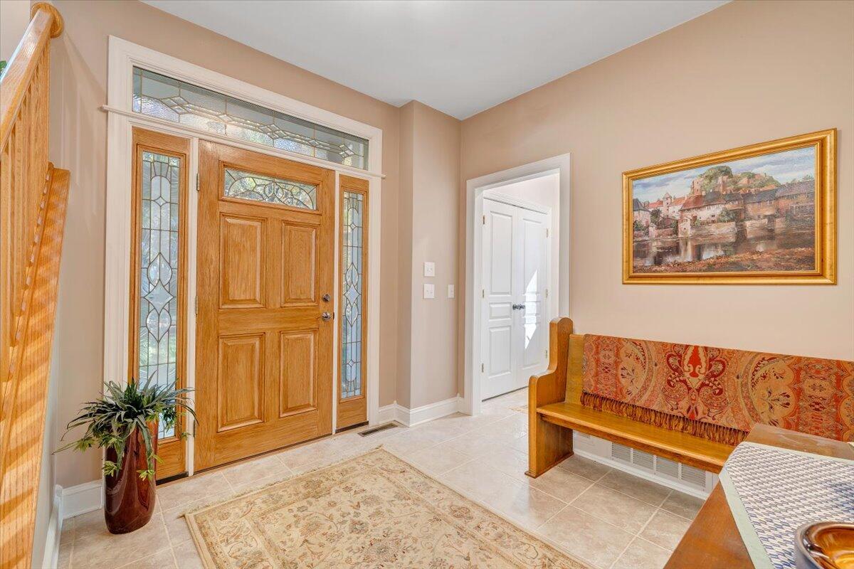 190 Tranquility Road Moneta, VA 24121 - Photo 8 of 170 a living room with a couch and a potted plant
