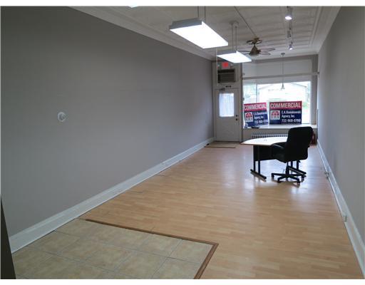 413 Bound Brook Road Middlesex, NJ 08846 - Photo 2 of 9 a living room with furniture and a chandelier