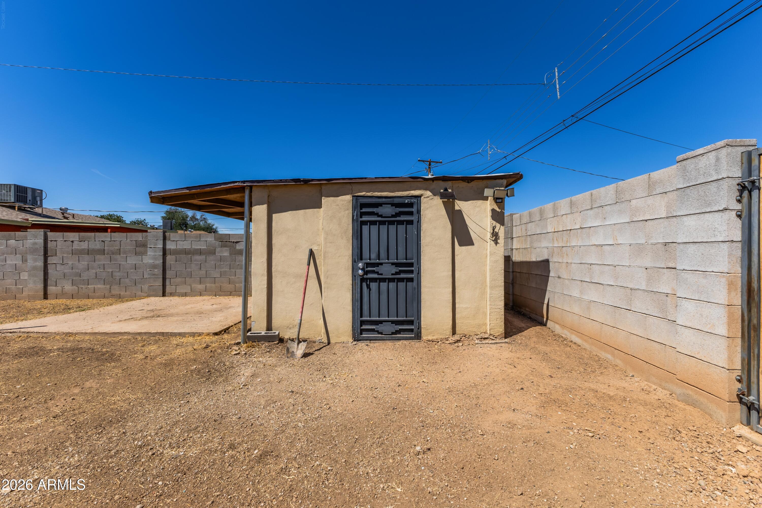 3137 North 37th Drive Phoenix, AZ 85019 - Photo 17 of 18 a view of backyard with small cabin