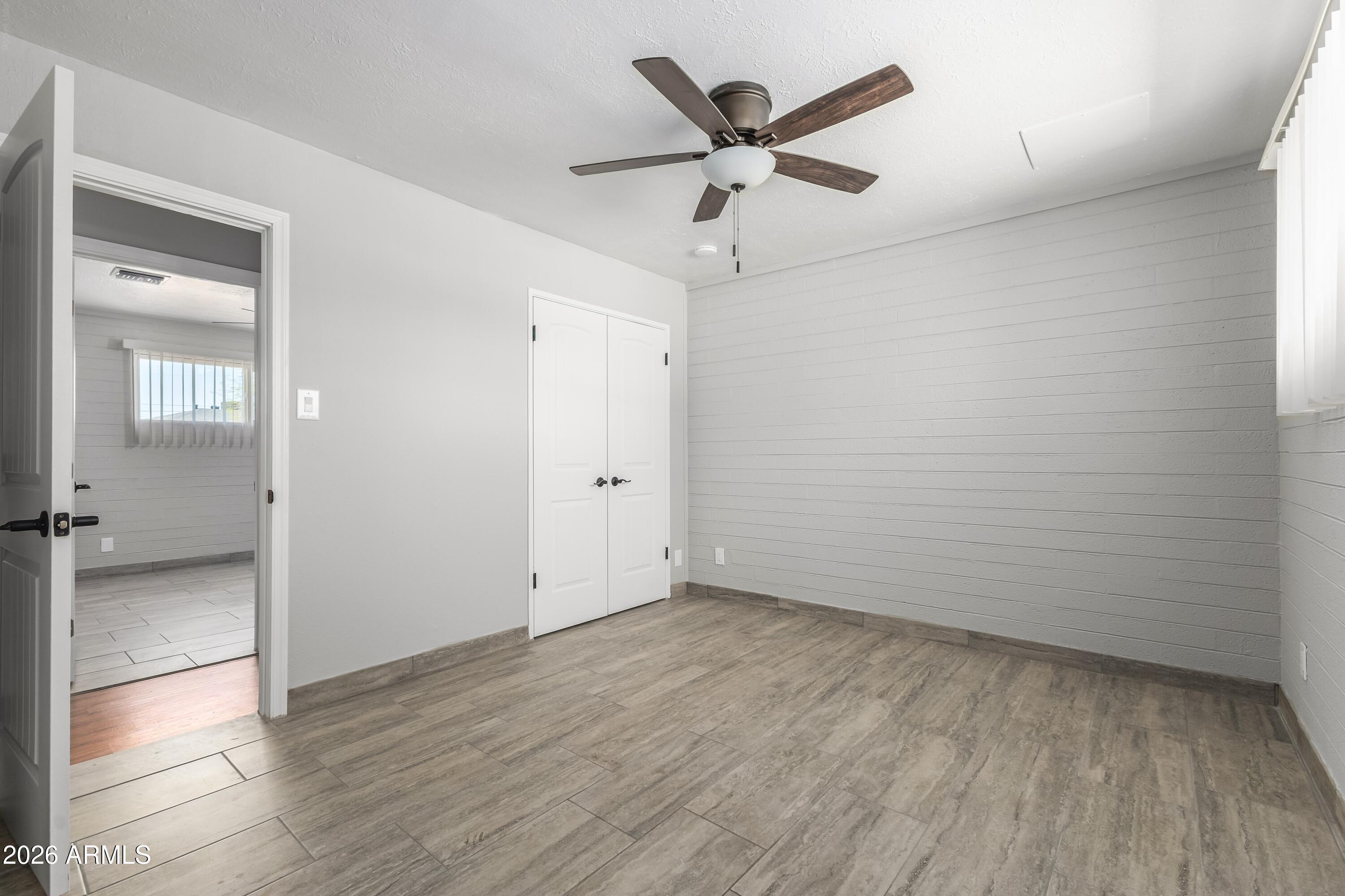 3137 North 37th Drive Phoenix, AZ 85019 - Photo 6 of 18 wooden floor in an empty room