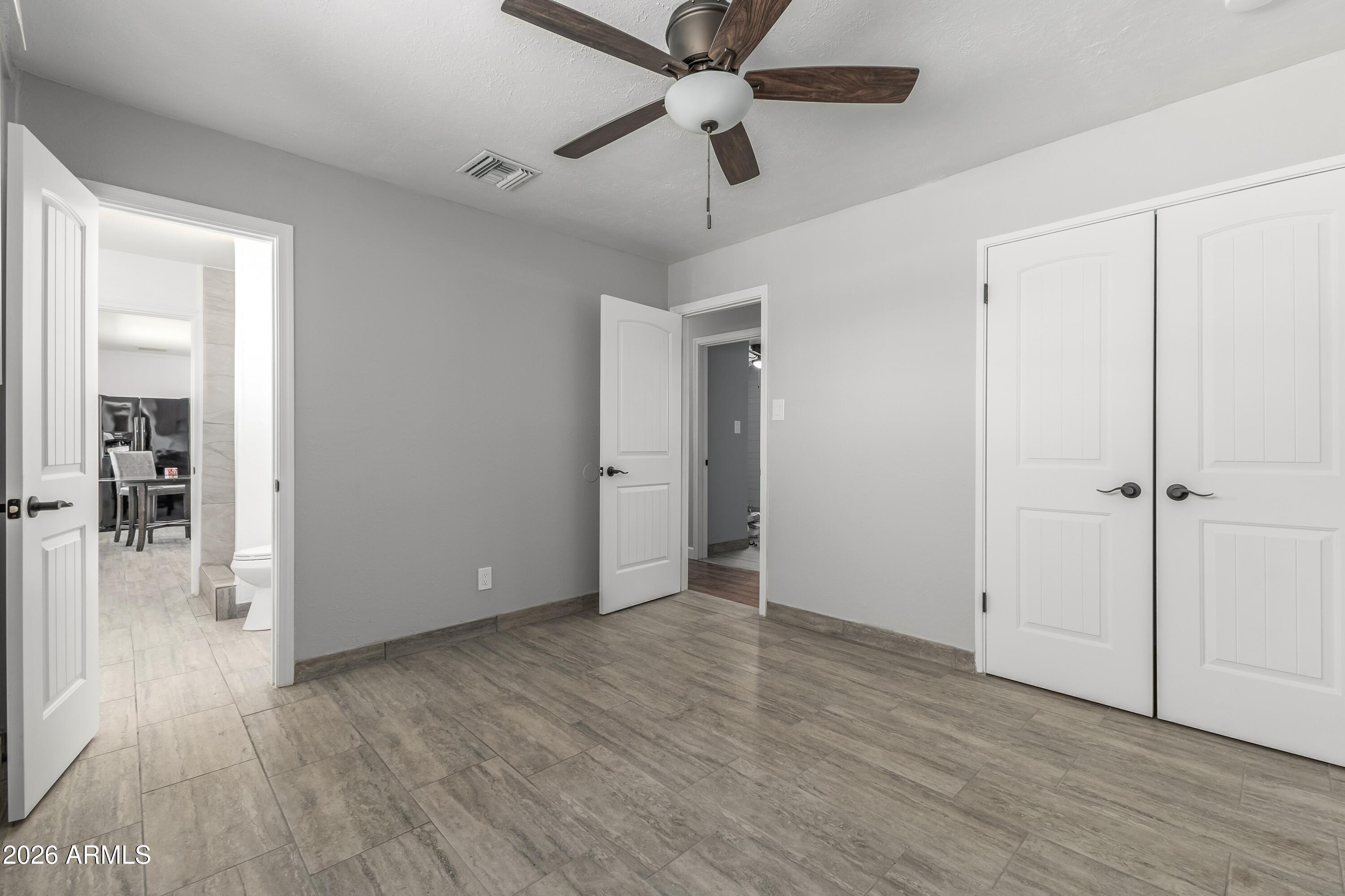 3137 North 37th Drive Phoenix, AZ 85019 - Photo 7 of 18 wooden floor in an empty room