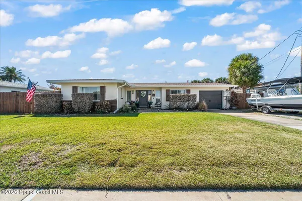 a view of a house with a big yard