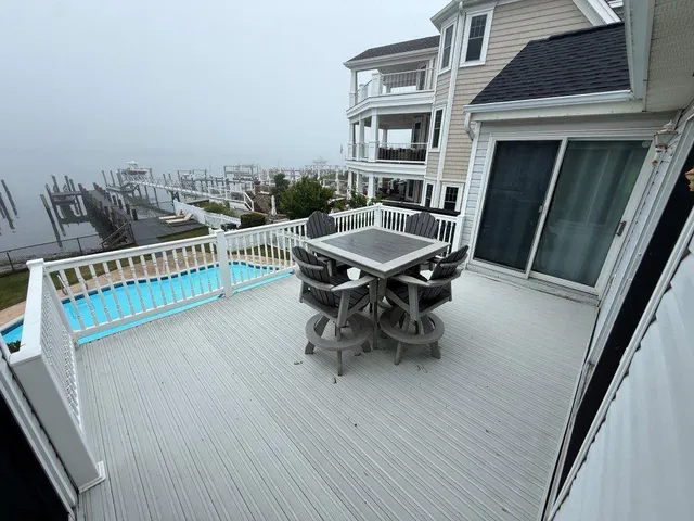 a terrace with outdoor seating and wooden floor
