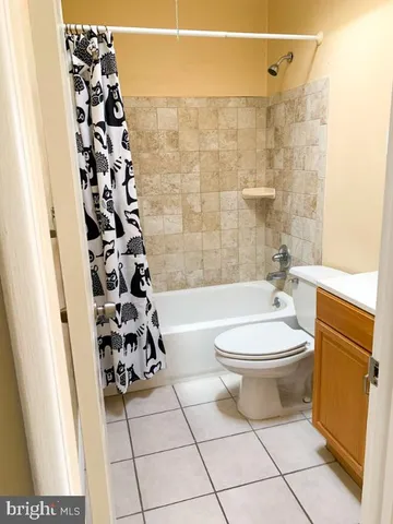 a bathroom with a toilet a sink and a shower