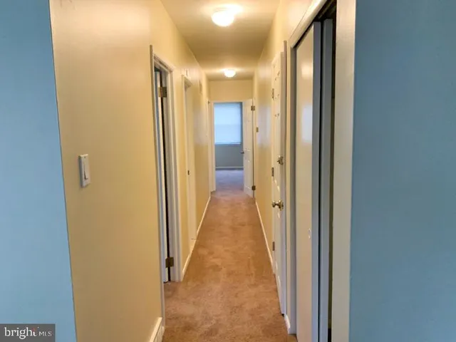 a view of a hallway with storage