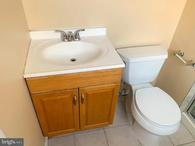 a bathroom with a toilet and a sink