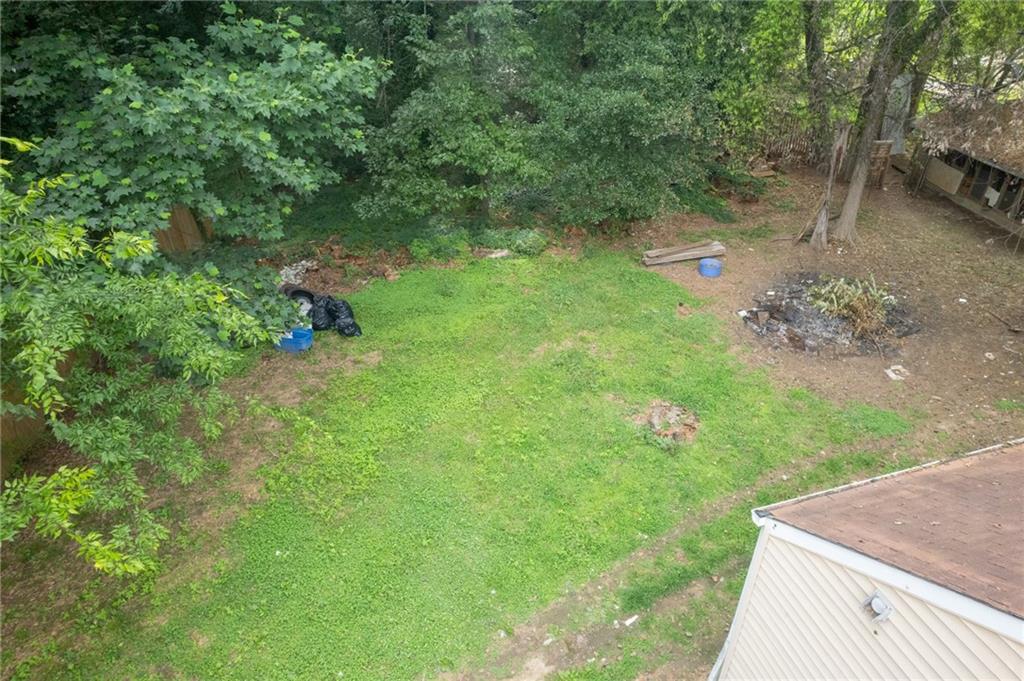 3838 Old Gordon Road Northwest Atlanta, GA 30336 - Photo 23 of 23 a backyard of a house with lots of green space