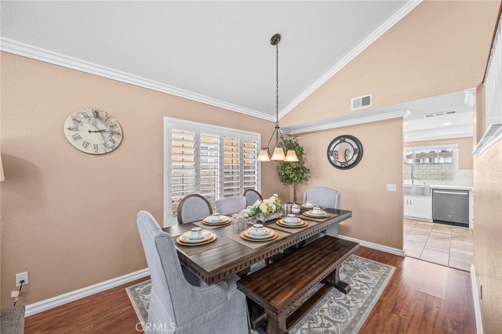 20257 Edmund Road Riverside, CA 92508 - Photo 11 of 53 a view of a dining room with furniture window and wooden floor